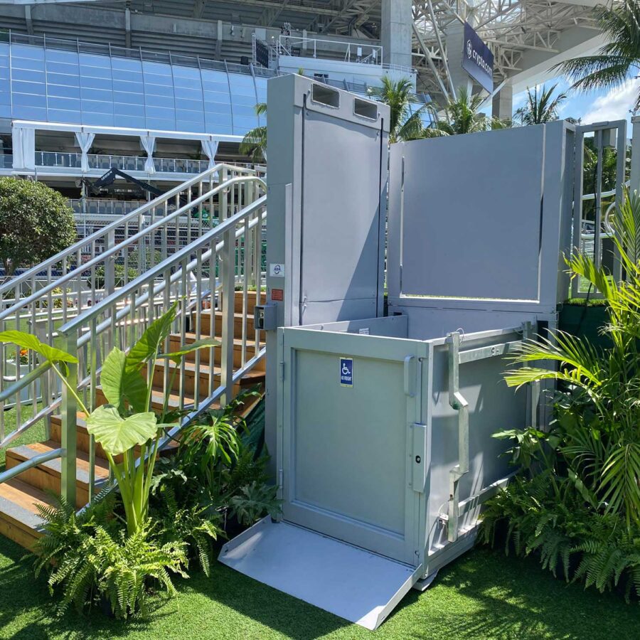 6' ADA Lift Rental grey, 6' ADA wheelchair lift rental next to stairs to a hospitality center at the F1 Miami Grand Prix