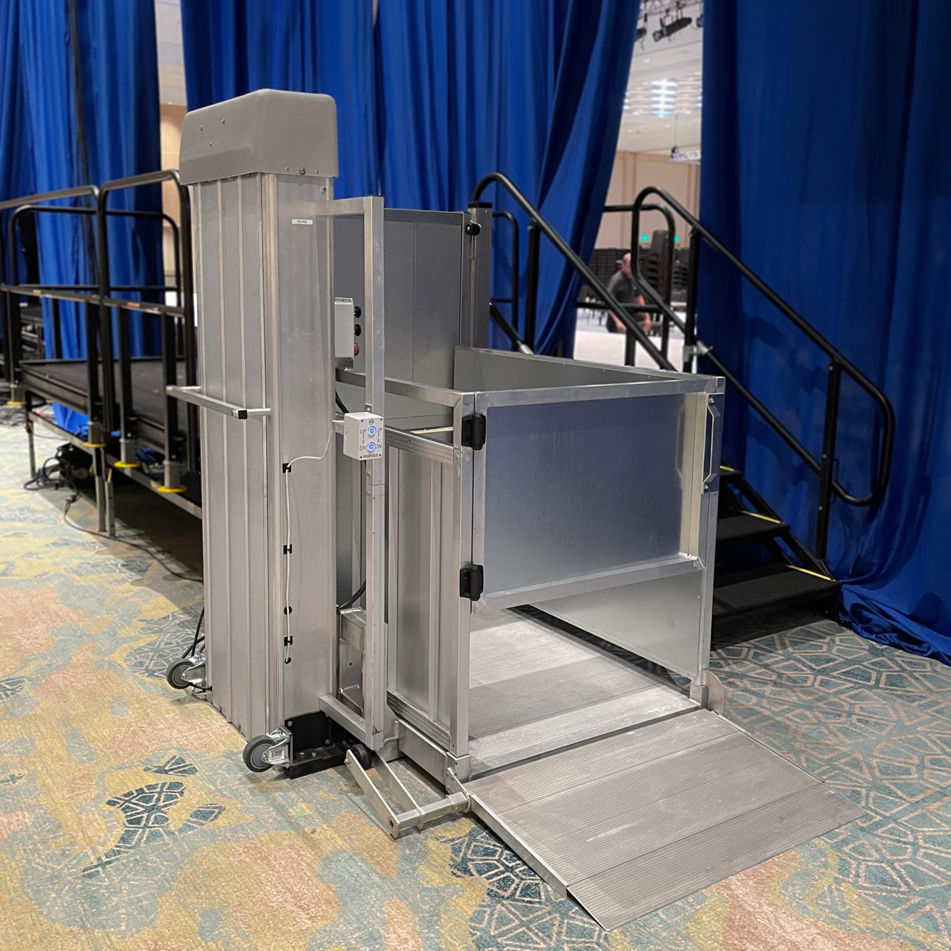 EZ Stage Lift wheelchair lift accessing a low height stage