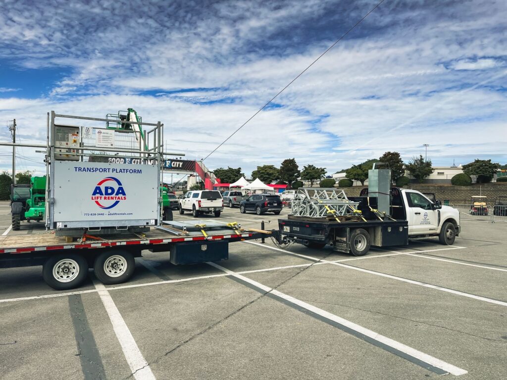 Transport Platform Lift Rental on trailer hauled by truck
